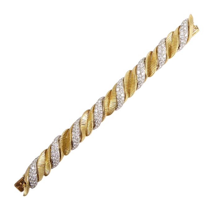   Cartier - Yellow gold and diamond leaf scroll strap bracelet, slightly bombe form alternating pave diamond scrolls with reeded gold leaf scrolls | MasterArt